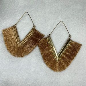 Women’s gold statement earrings